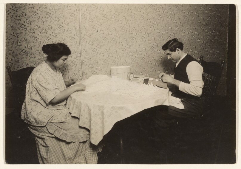 [Couple Rolling Cigarettes in Tenement Home, N.Y.]