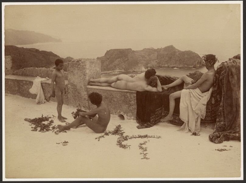 [Four nude boys lounging]