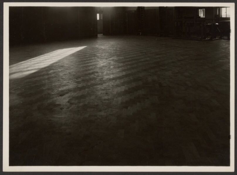 [Large Empty Room with Parquet Floor]
