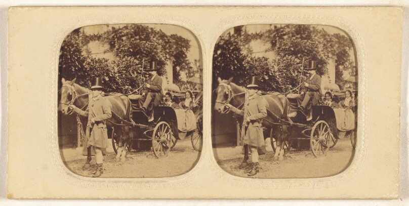 [Two women in a horse-drawn carriage with two men drivers wearing top hats, one man standing by horse]