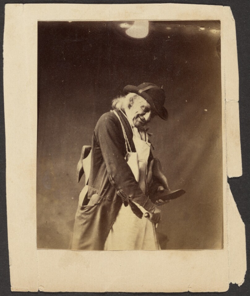 [Portrait of an Elderly Man in Hat Holding Some Tools]