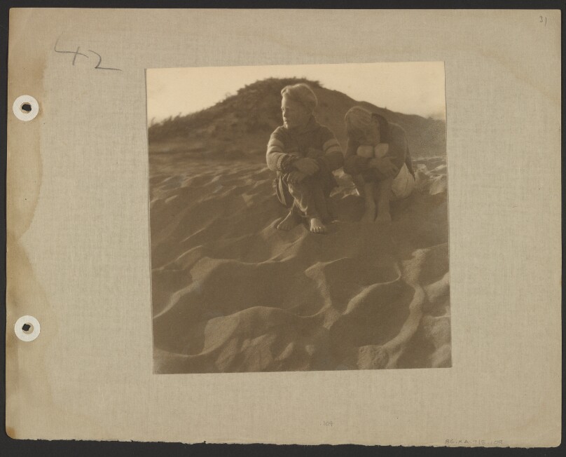 [Chandler and Brett Weston sitting on sand dunes]