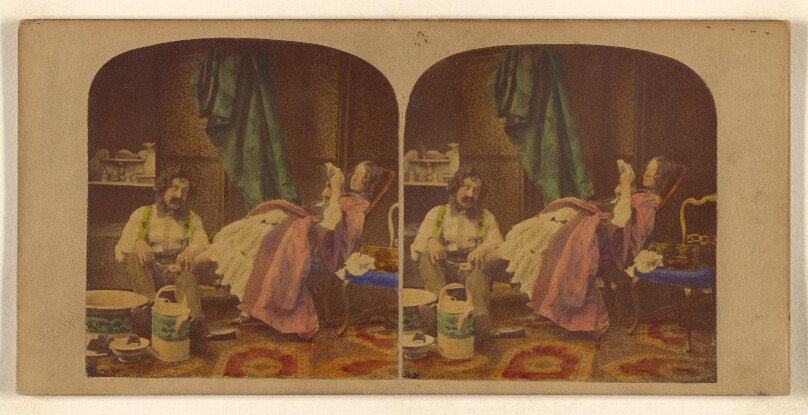 [Genre scene: man with bushy moustache seated bathing feet of woman seated reading a book]