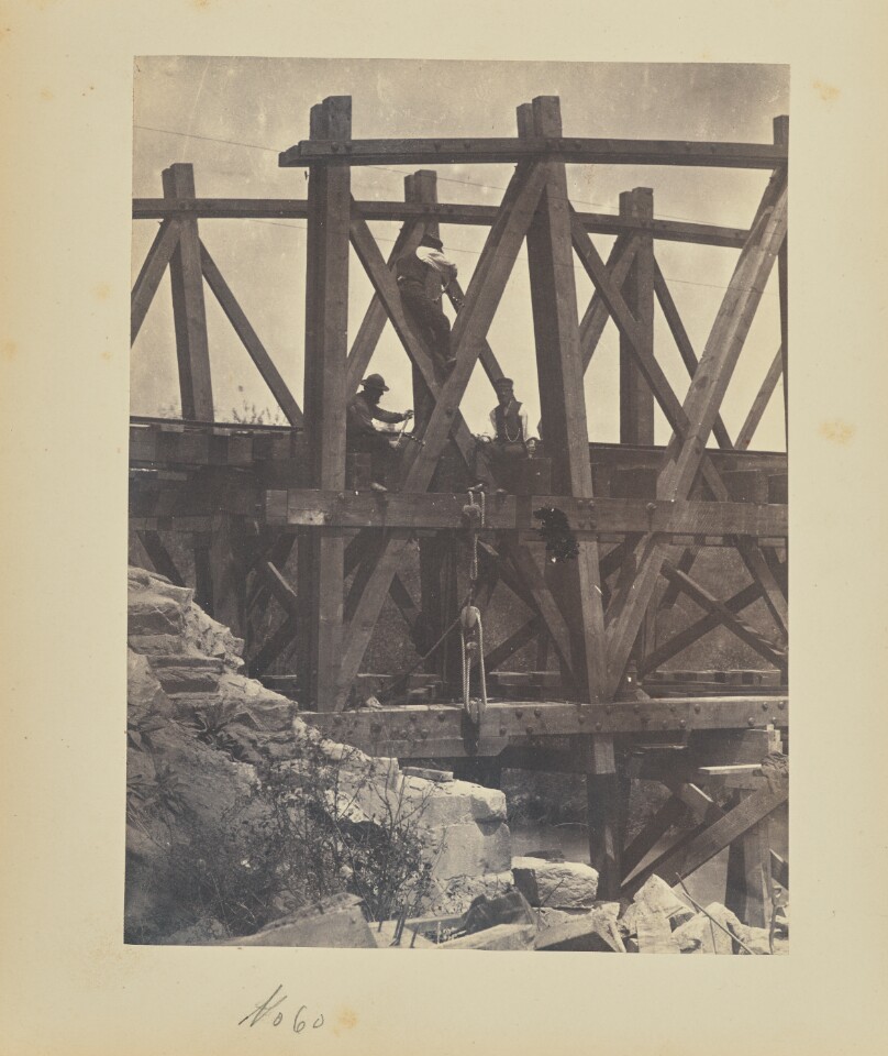 [Boring holes in a bridge truss for explosives]