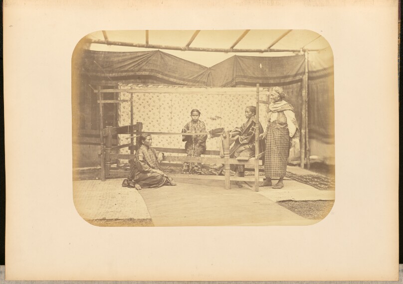 [Group portrait at a loom]