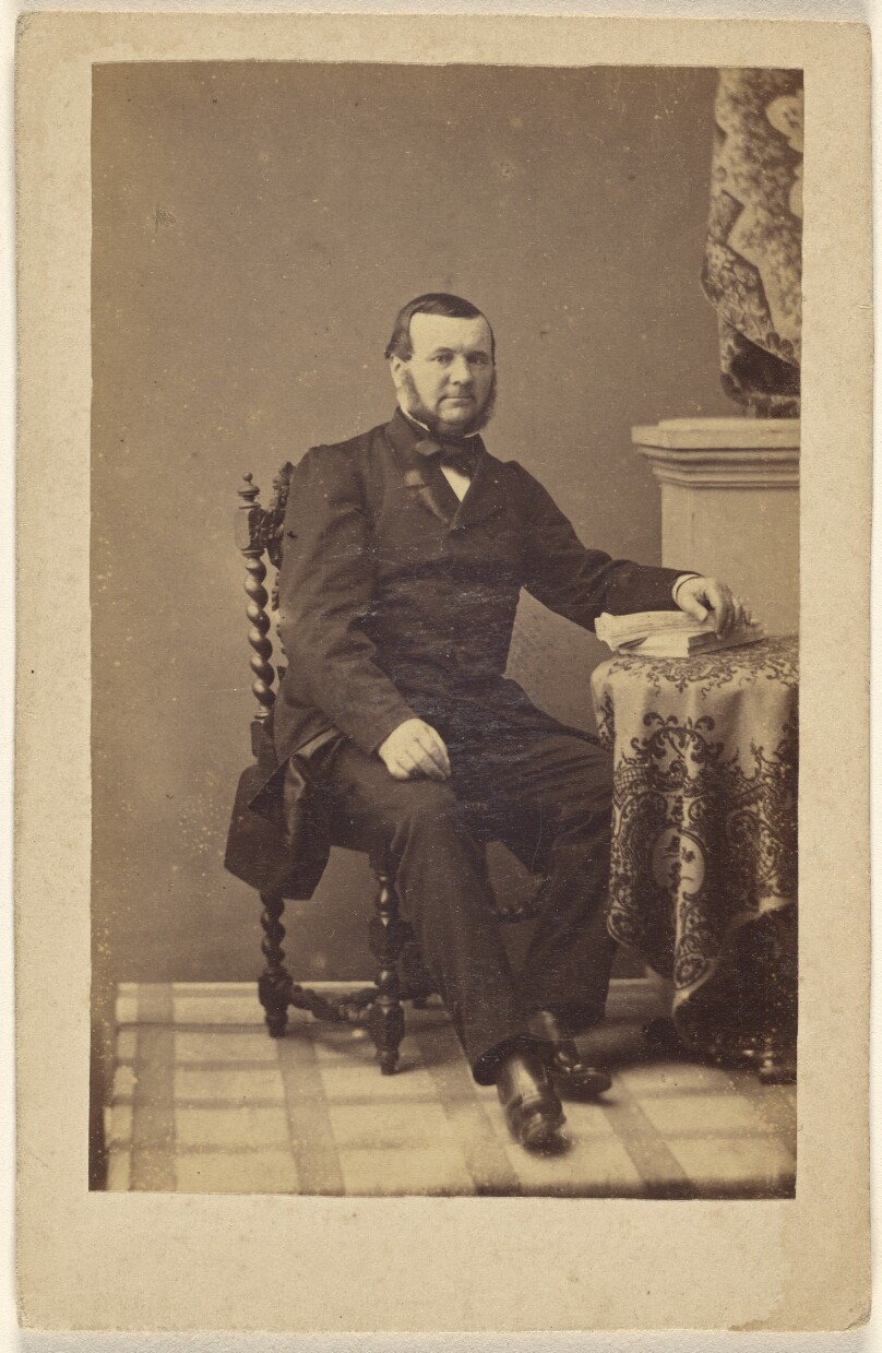 [Unidentified bearded man, seated]