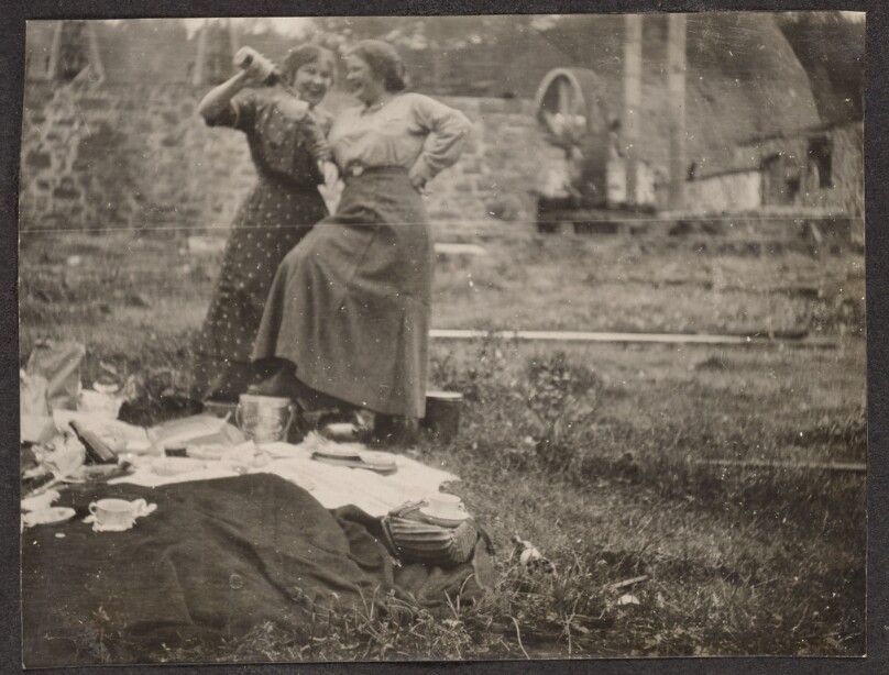 [Women drinking at a picnic]