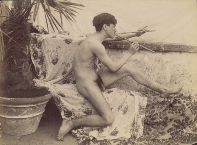 [male nude playing two flutes]