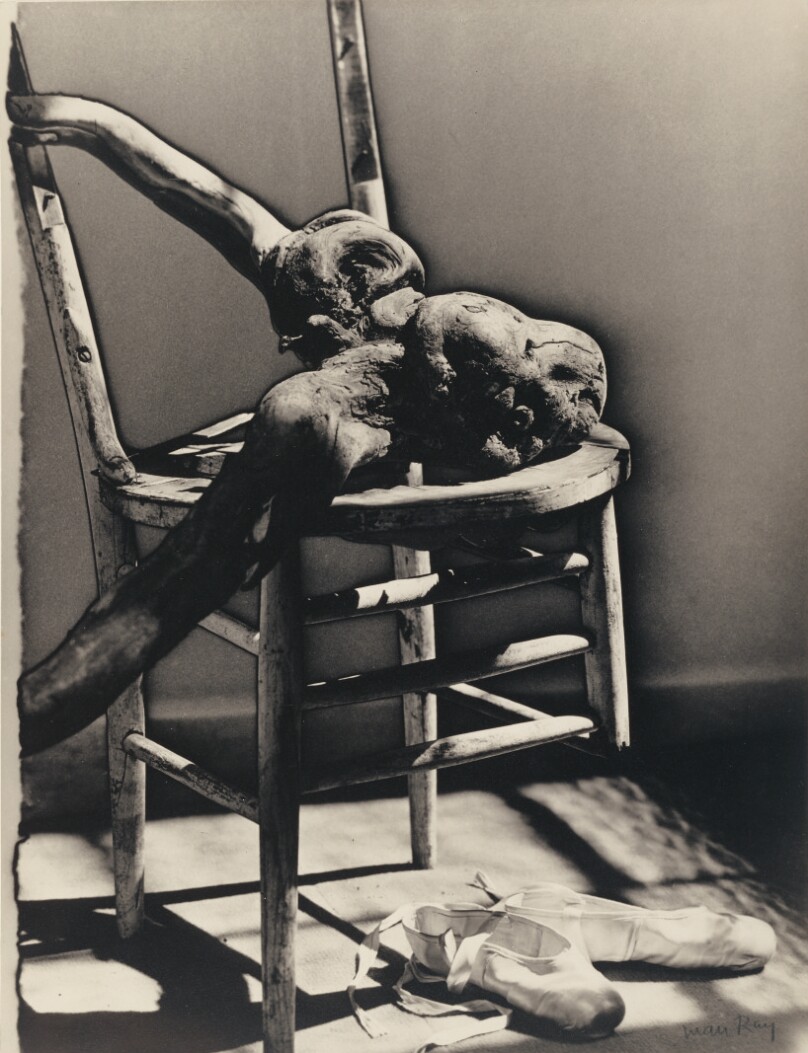 [Broken chair with stump and ballet shoes]