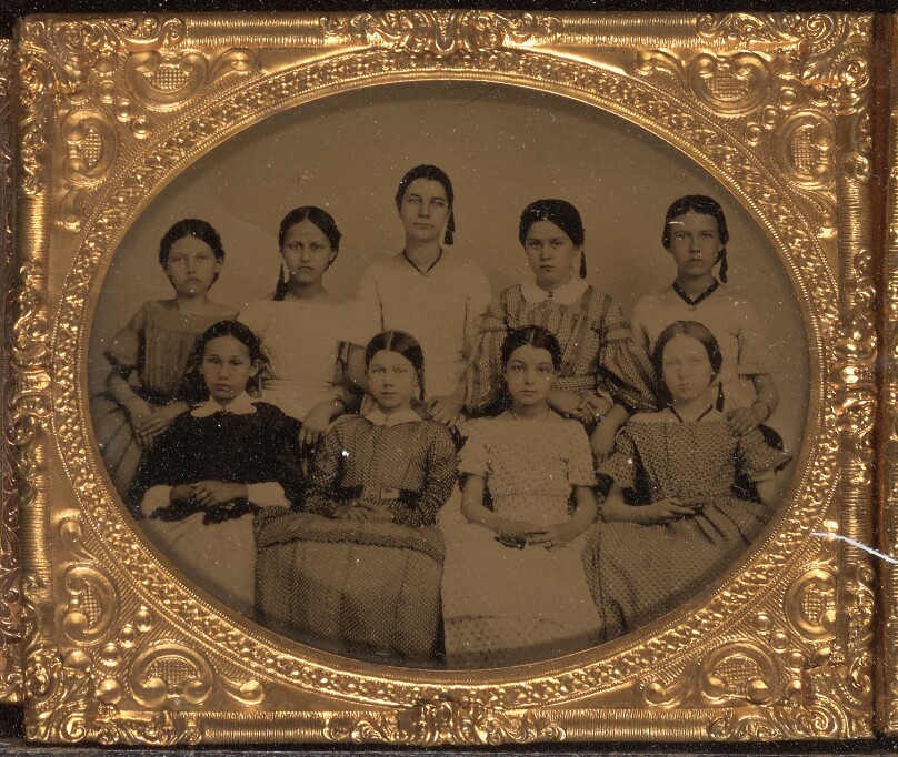 [Group portrait of nine young women]