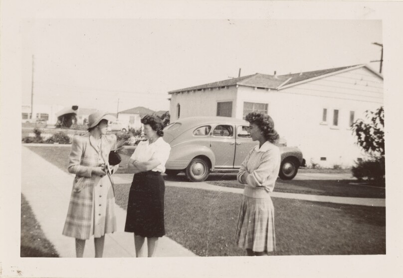 [Three women on sidewalk]