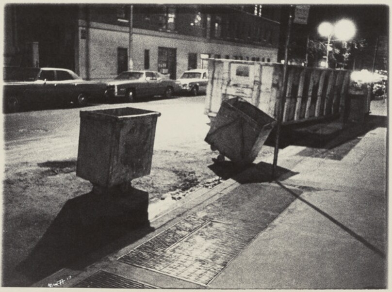 Two Small Black Dumpsters