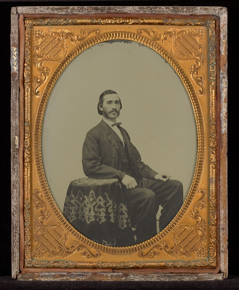 [Portrait of a Man Seated at a Cloth Covered Table]