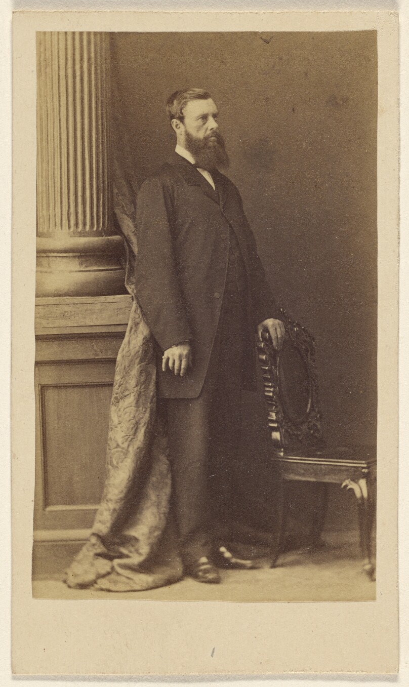 [Unidentified full-bearded man, standing]
