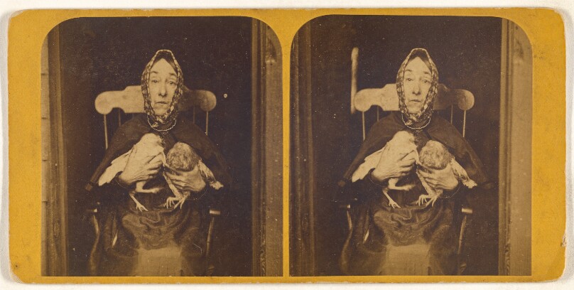 [Nancy Luce holding two owls to her chest: Inkey Pinkee and Winkee Pinkee]