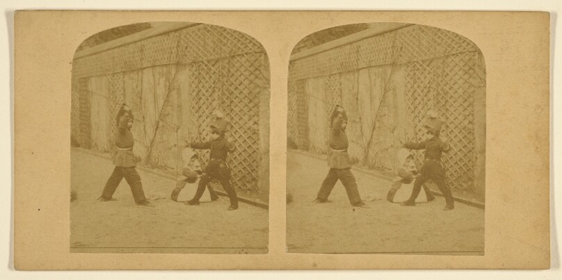[Children play fighting]