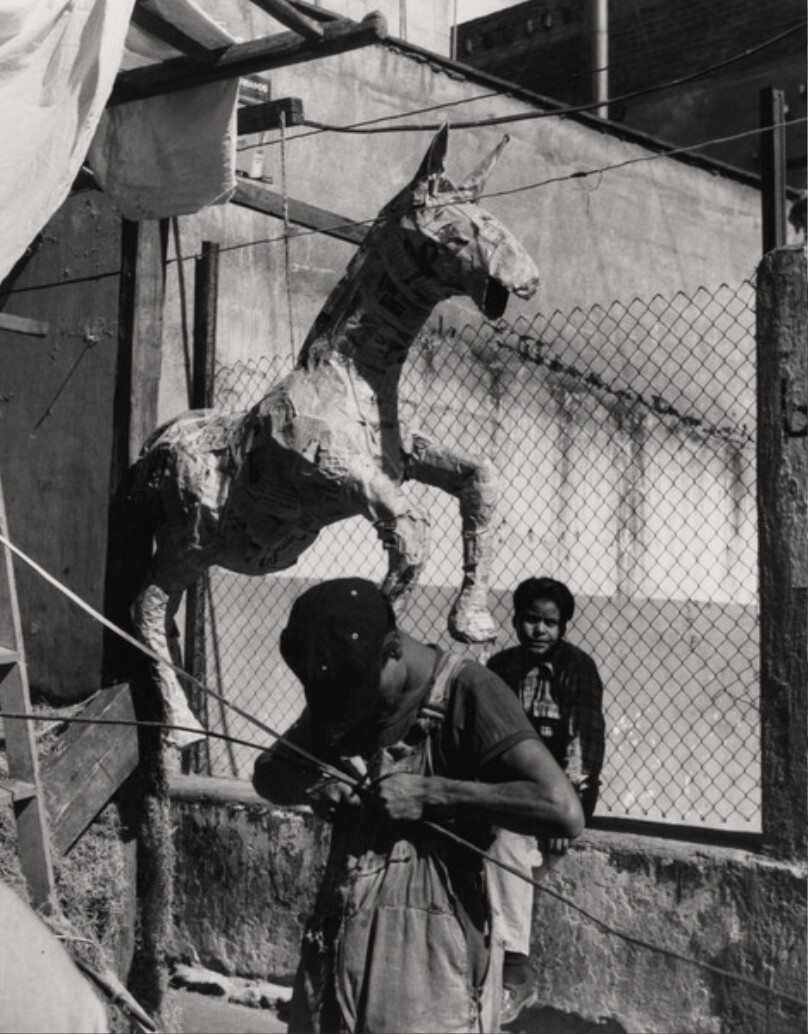 [Two boys with paper mache horse]
