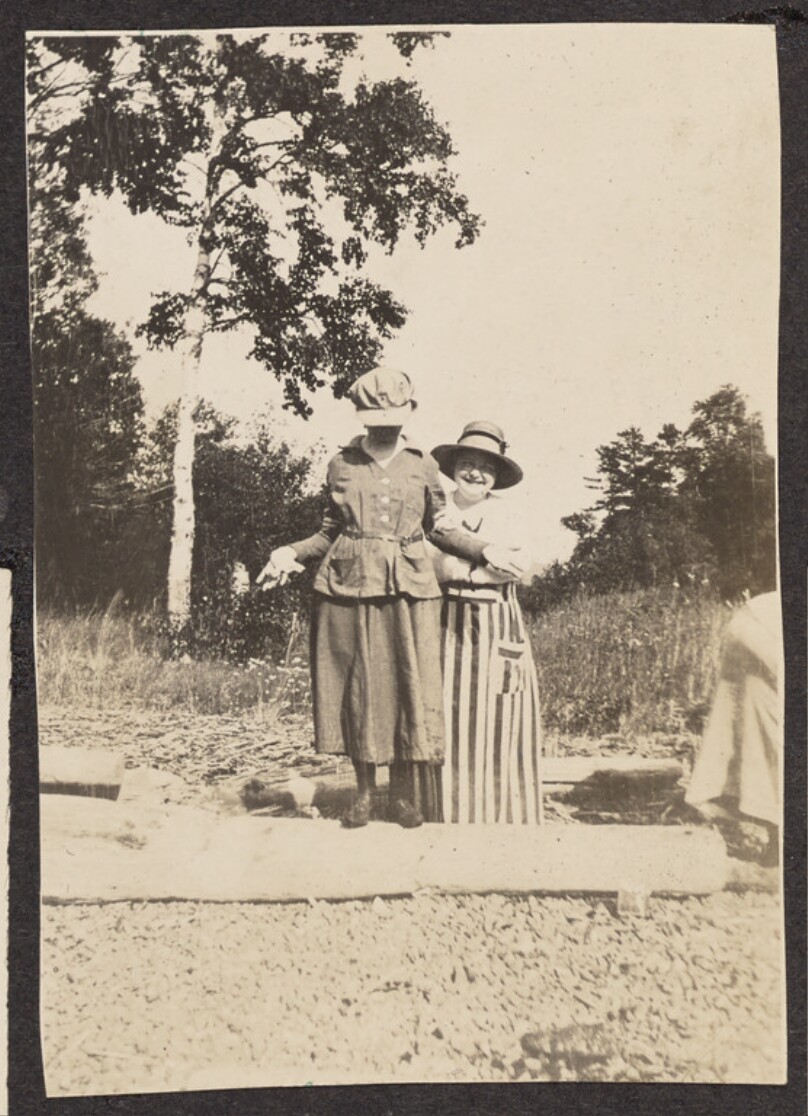 [Women on a rocky beach]