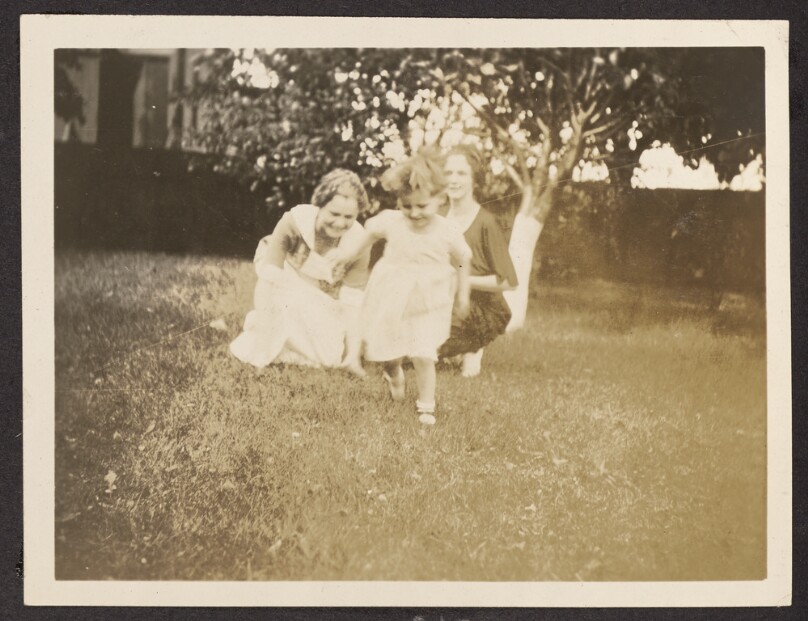 [Women playing with a child]