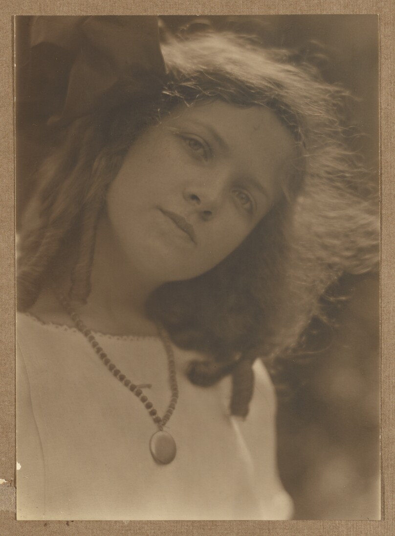 [Girl with hair in ringlets, large bow]