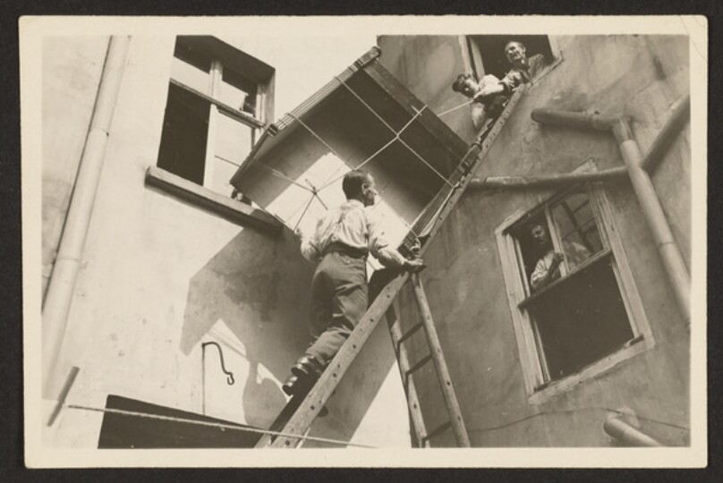 [Transportation of Armoire by Four Men]