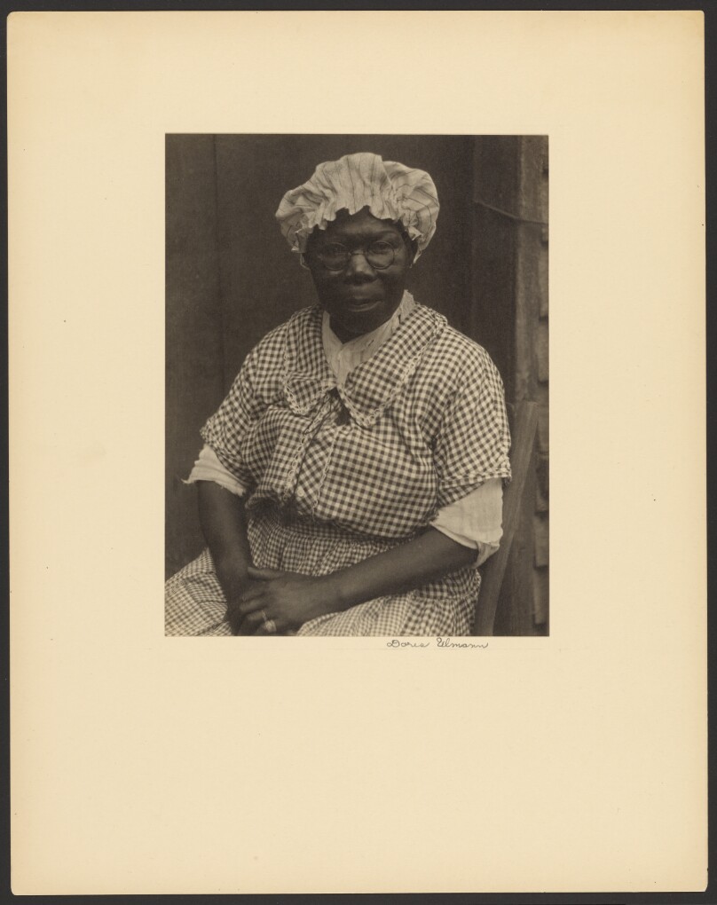 [Black Woman in Cap and Gingham Dress]