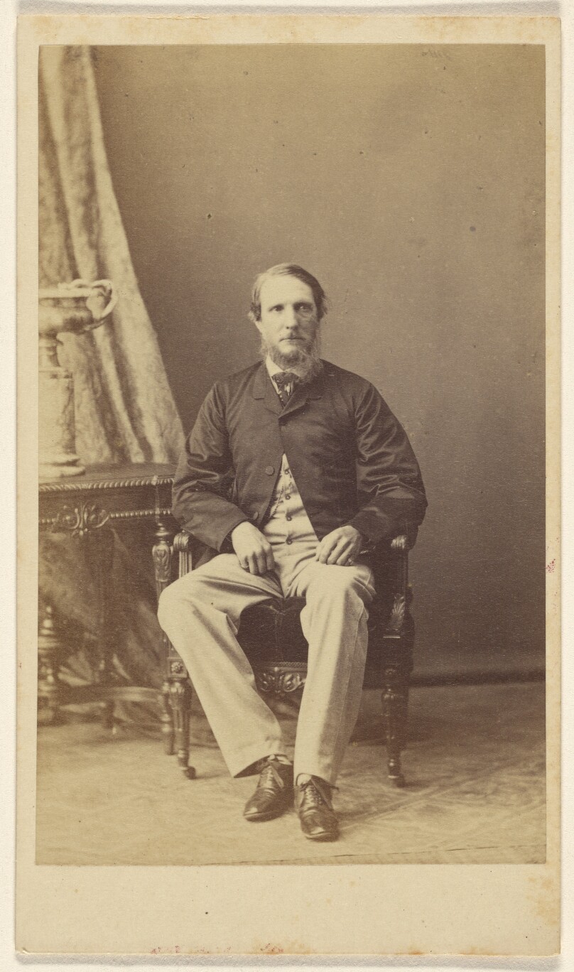 [Unidentified bearded man, seated]