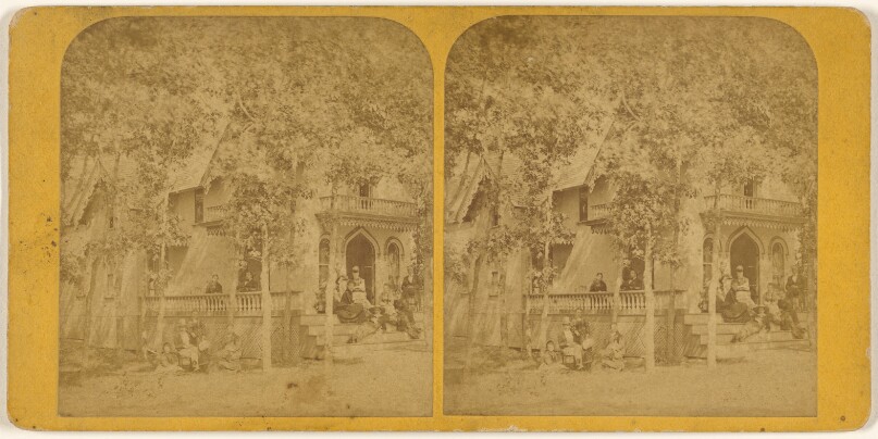 [View of house with people on porch]