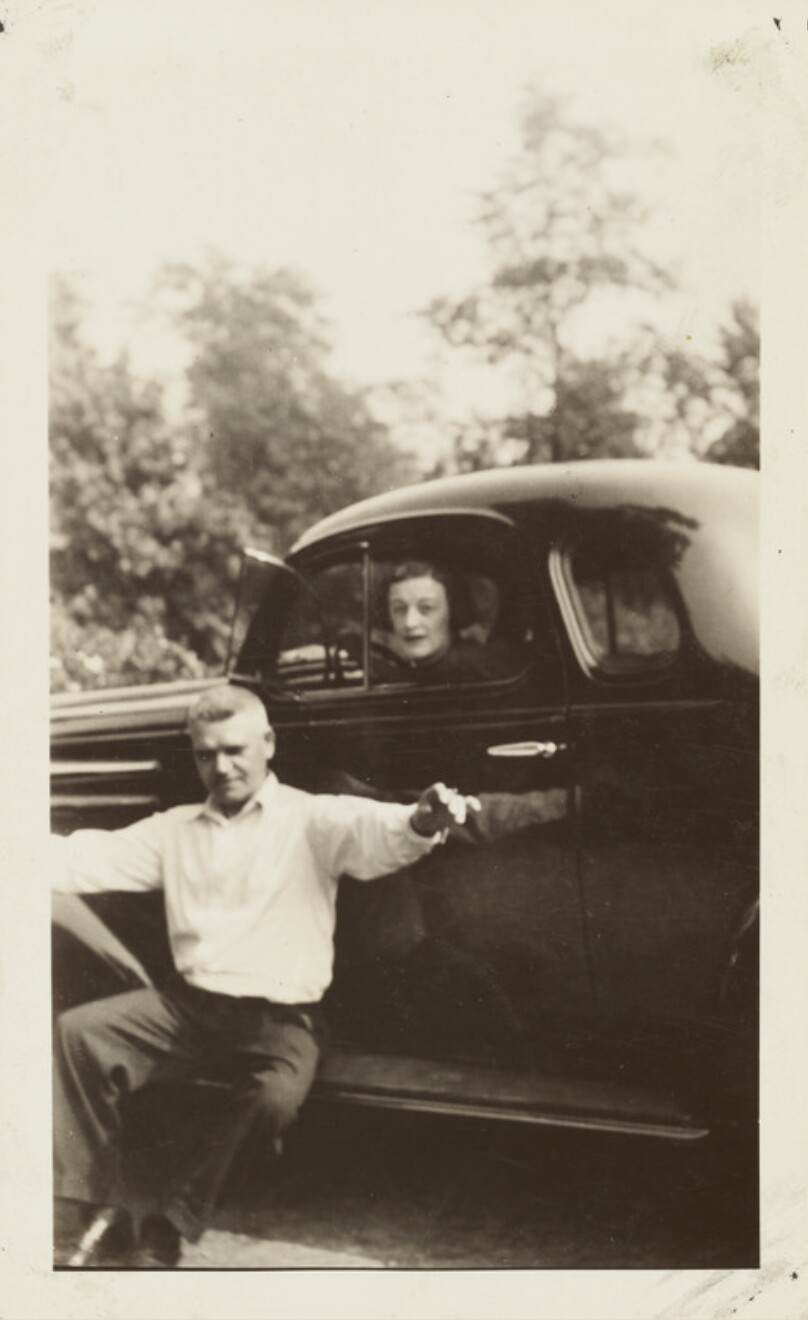 [Man and woman with car]