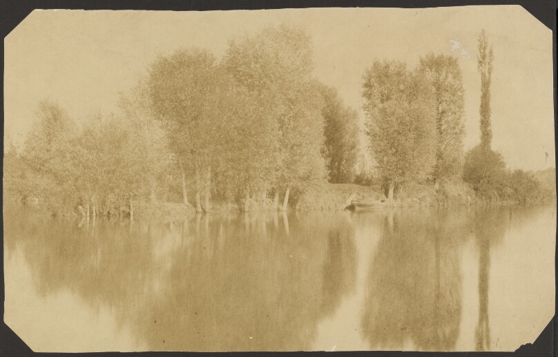 [River Bank from across the Water with Boat]