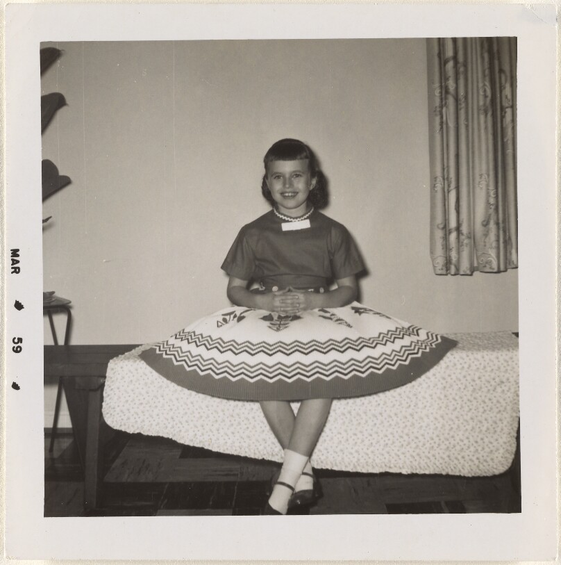 [Seated girl]