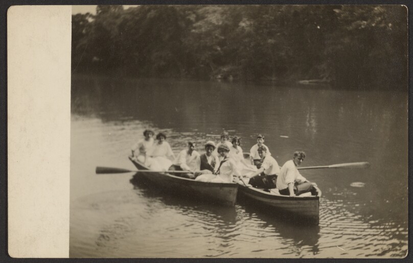 [Group in rowboats]