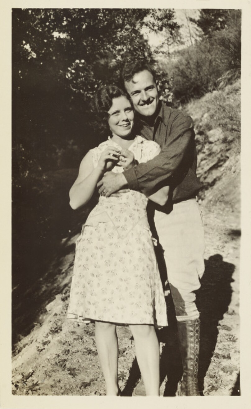[Couple embracing outdoors]