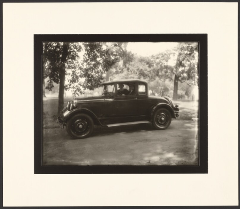[Older Couple Seated in a Car]
