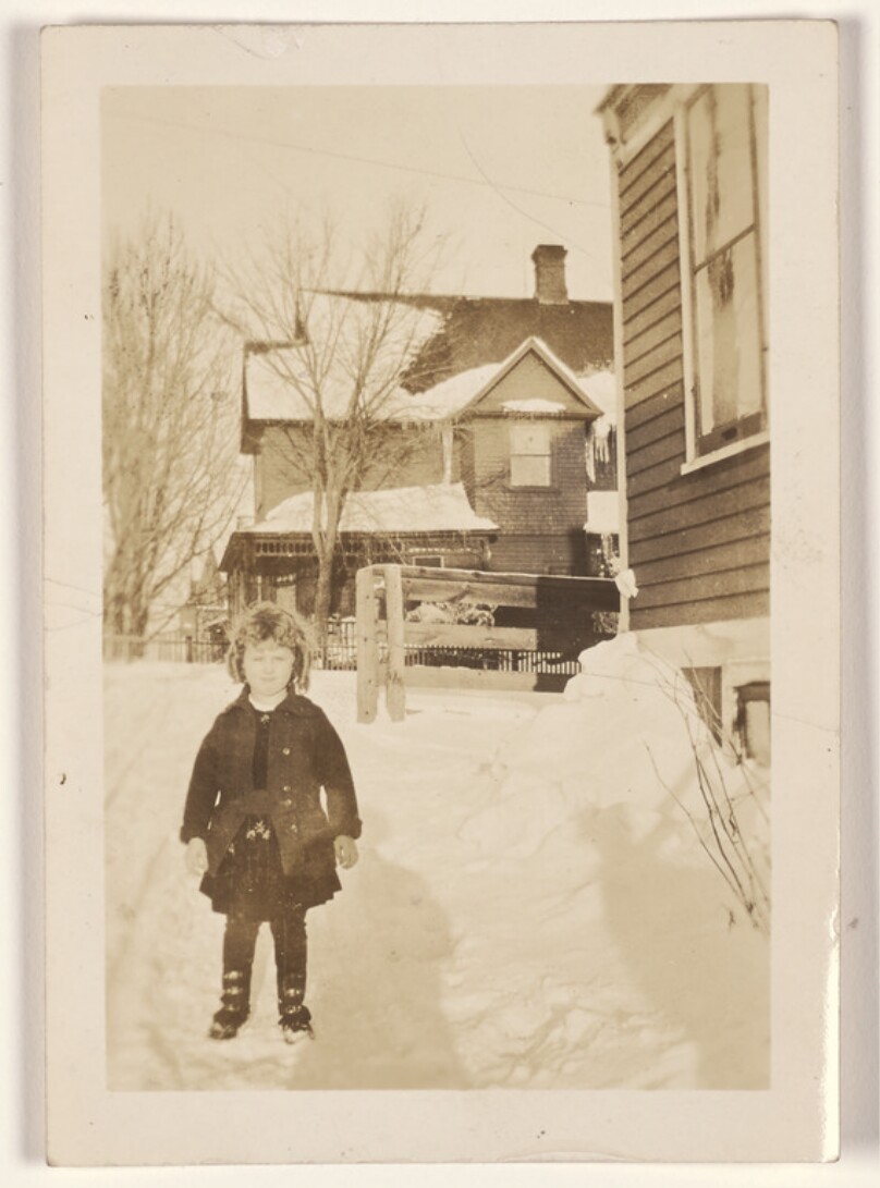 [Girl standing in the snow]