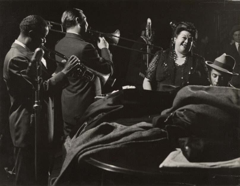 [Singer Mildred Bailey and Louis Armstrong Playing Trumpet in Esquire Jam Session]