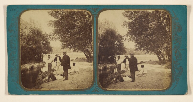 [Men near riverbank]