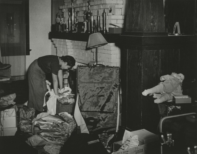 [Woman packing up house]