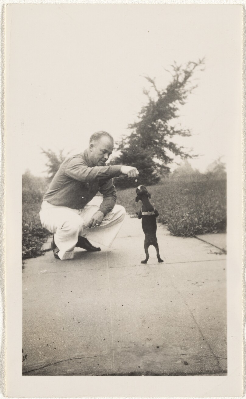 [Man with begging dog]