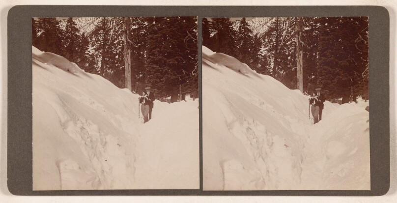 [Couple posed on snow-covered hill]