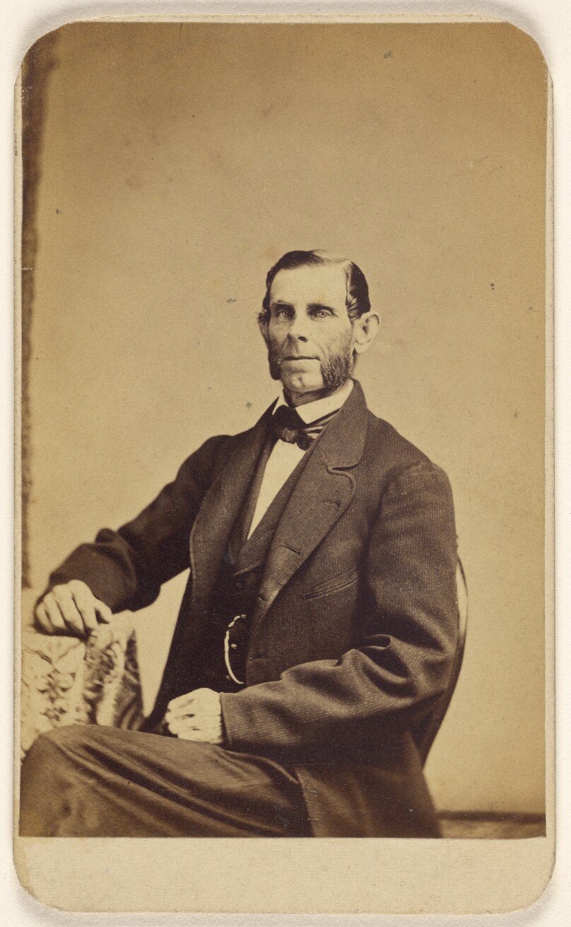 [Unidentified man with full muttonchops, seated]