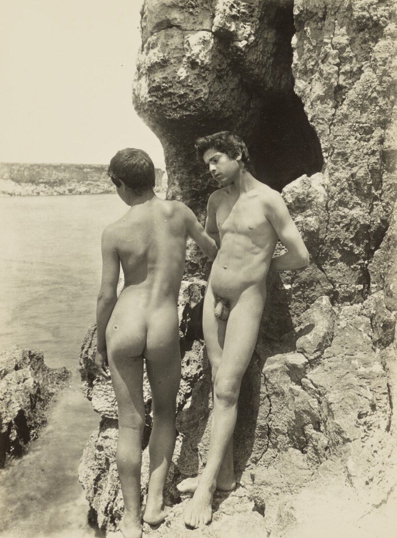 [Two nude youths by the sea]