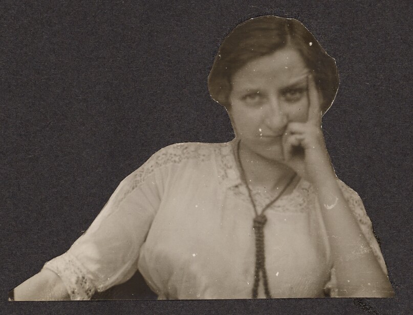 [Woman resting her head in her hand]