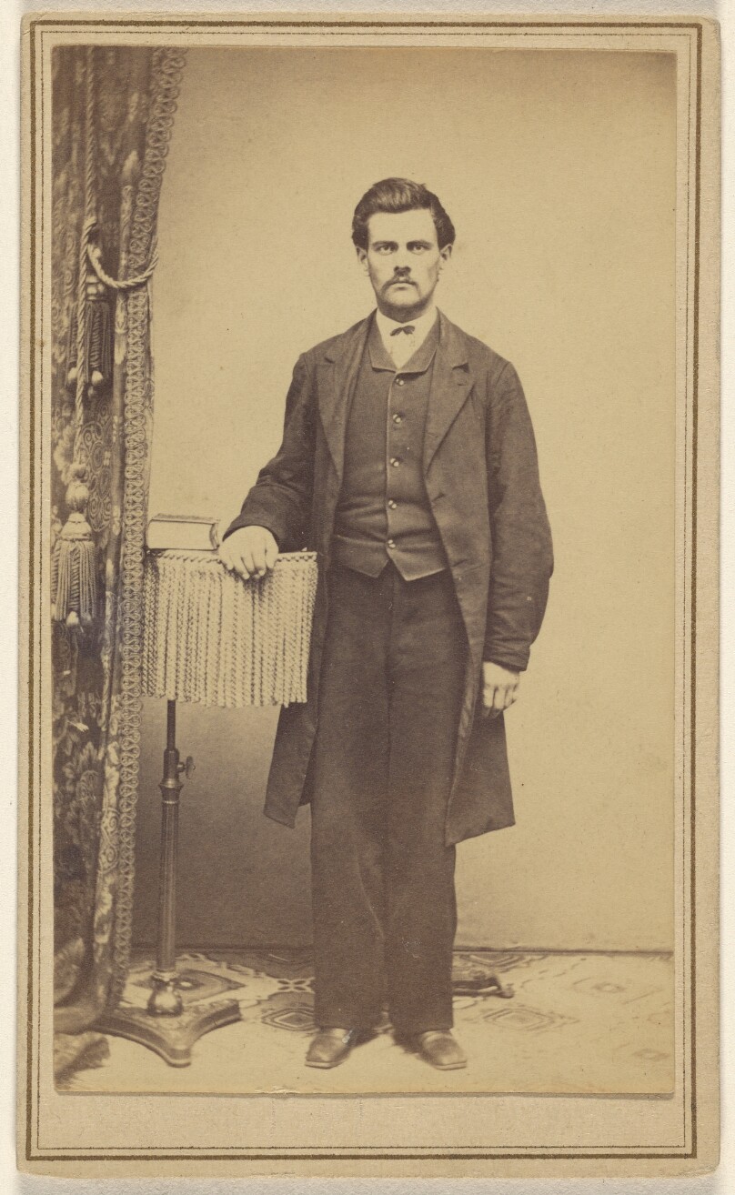 [Unidentified man with moustache, standing]