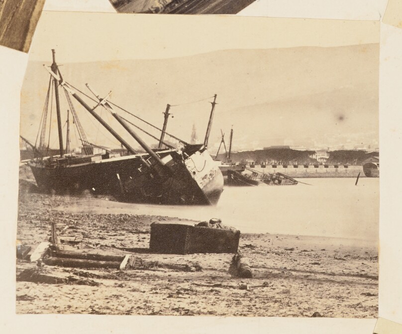 [Harbor View with Stranded Boats and Ships]