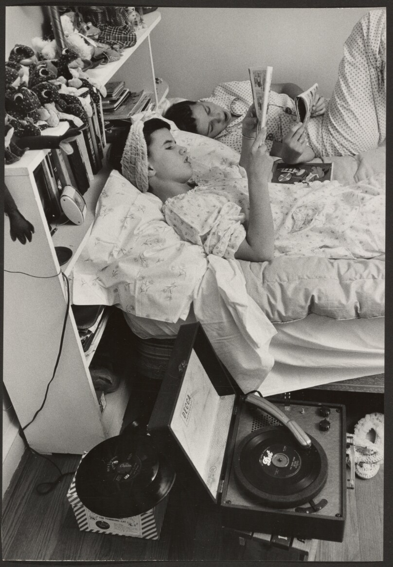 [Two Girls in Bed Reading and Listening to Music]