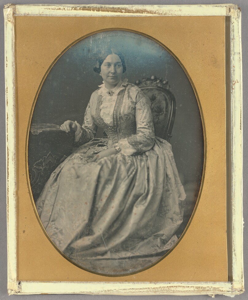 [Portrait of a Seated Woman in Long, Flowing Dress]