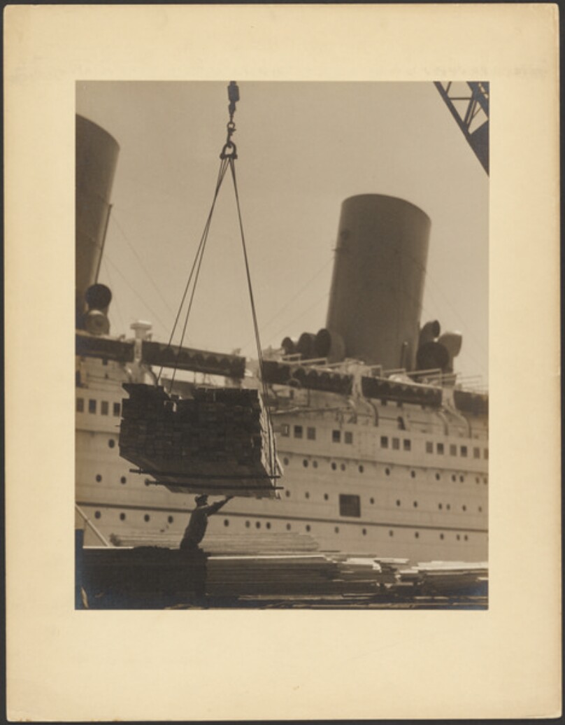 [Lumber being loaded on ship]