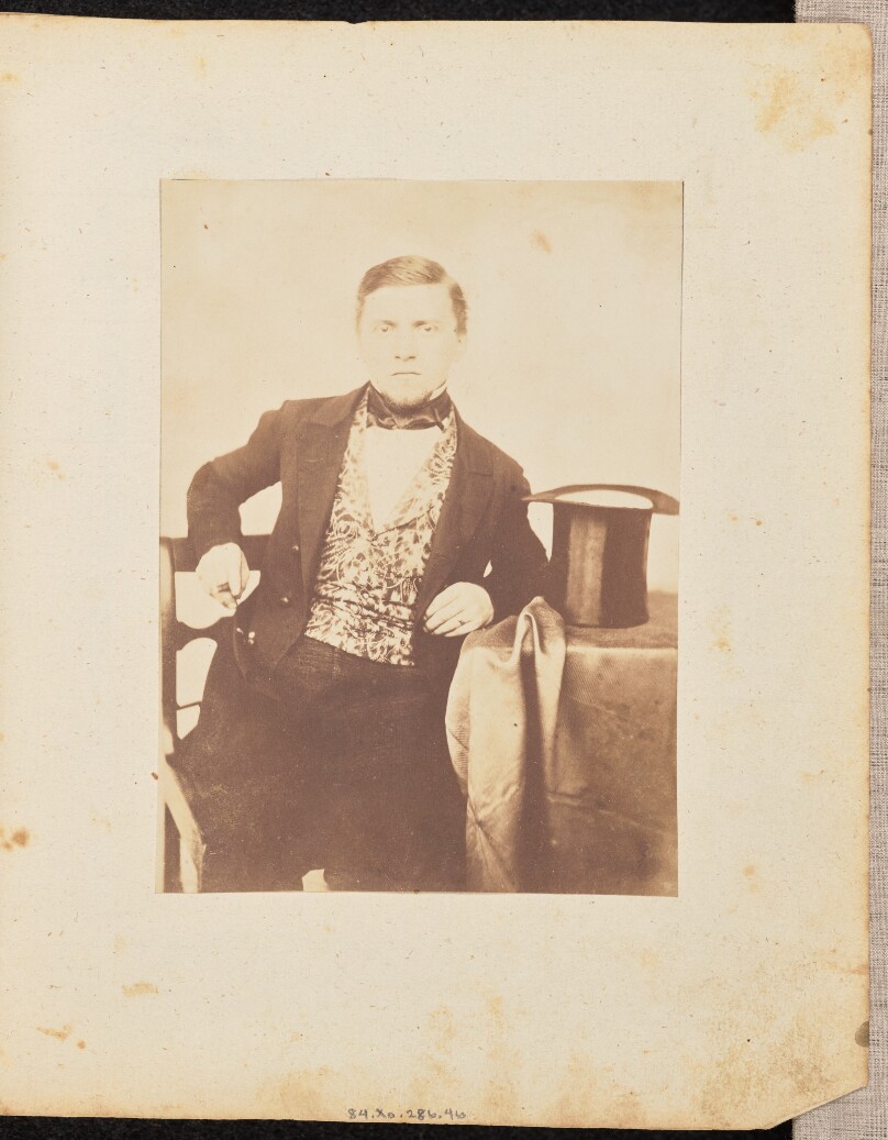 [Portrait of a man with a cigar and top hat]