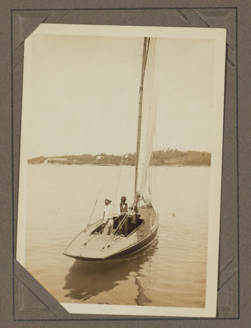 [Two men on a sailing boat]